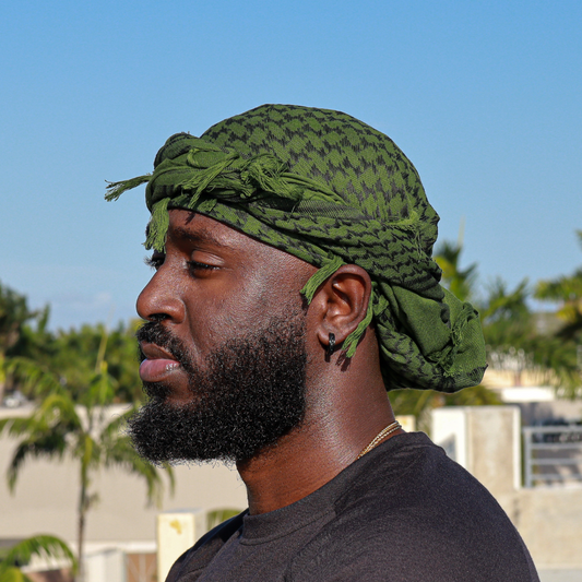 dark green head wrap with black spots