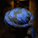 blue flowers on male turban 